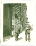 Police constable and man on sidewalk by Unknown
