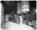 Factories - Stockton: Interior of unidentified inductrial plant, storage tanks, cans/crates by Van Covert Martin