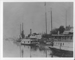 Steamboats-Stockton-unidentified steamboats and sailboats docked at Weber Warehouse by Van Covert Martin