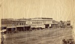 Stockton - Streets - 1850s - 1870s: H.S. Sargent Groceries, Birds Saddle and Harness Depot, Great Auction House (Melone and Davis) M.L. Kaisers clothing, Knickerbocker Restaurant by Unknown