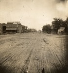 Stockton - Streets - 1850s - 1870s: Looking west on Weber Ave. at Sutter St., Stockton-Copperopolis railroad depot in center by Unknown
