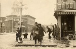 Stockton - Streets - c.1920 - 1929: Main St. in snow. Court House by Unknown