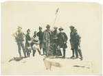 (left to right) [Donald Ryder Dickey, Anna Ryder Dickey, Alicia Mosgrove, Thornton Kinney], John Muir, [Henry Gannett, Theodore Hittell, Helen Greame, and Kent Kinney] on summit of Mount Whitney, California