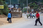 People on a road in Liping by Marie Anna Lee