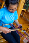 Repairing backstrap loom by Marie Anna Lee
