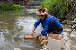 Wu Huancan washing mulberry bark by Marie Anna Lee