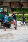 Wu Gaitian's son repairs truck by Marie Anna Lee