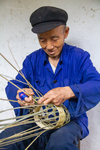 Wu Zhenguo weaving a basket by Marie Anna Lee