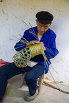 Wu Zhenguo weaving a basket by Marie Anna Lee