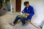 Wu Zhenguo weaving a basket