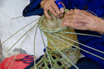 Wu Zhenguo weaving a basket