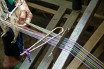 Fixing a broken thread on frame loom by Marie Anna Lee