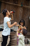 Woman and children drinking soda