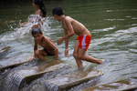Children playing in river by Marie Anna Lee