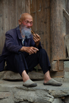 Man smoking a pipe by Marie Anna Lee