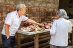 Selling pork in Liping by Marie Anna Lee
