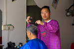 Barber in Liping by Marie Anna Lee