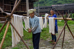 Women wringing cotton skeins by Marie Anna Lee