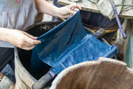 Anastasya dyeing indigo fabric