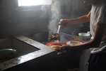 Wu Fengxiang cooking meat