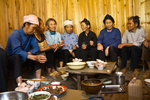 Talking and drinking rice wine at lunch gathering by Marie Anna Lee
