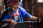 Weaving on horizontal loom by Marie Anna Lee