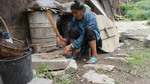 Mashing boiled bark into paper pulp