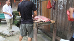 Butchering pig carcass