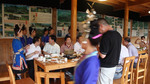 Government officials at long table dinner by Marie Anna Lee