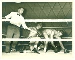 Campus Life-Block P-Two boxers and referee in ring at Block P sports show by unknown