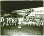 Football-University of the Pacific football team and supporters in front of Pan American plane by unknown