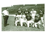 Football-University of the Pacific football players and coach on field by Leonard Covello