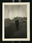 Football-Man standing next to field with University of Chicago buildings in background by W.F. Hodges Photos