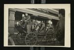 Football-University of the Pacific team members on horse-drawn wagon on display during trip to Chicago by W.F. Hodges Photos