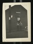 Football-Two men standing in front of Paradise station during trip to Chicago by W.F. Hodges Photos