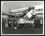 Football-University of the Pacific team members next to Pan-Am plane by unknown