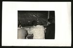 Football-Three men, probably in press booth during game by unknown