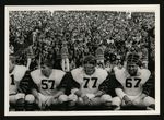 Football-Three unidentified members of University of the Pacific team sitting with crowd in background by unknown
