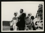 Football-University of the Pacific coach Doug Scovil and players on sidelines by unknown