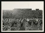 Football-Bands and cheerleaders on field during Homecoming game by unknown