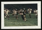 Football-University of the Pacific player running with ball during game by unknown