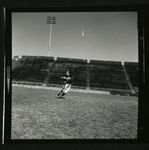 Football-Unidentified University of the Pacific player catching the ball during practice by unknown