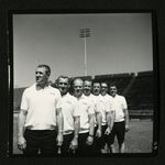 Football-University of the Pacific coaches lined up on field by unknown