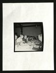 Football-University of the Pacific coaches and others eating at table by unknown