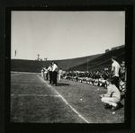 Football-University of the Pacific coaches and players on sidelines by unknown