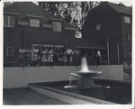 Raymond College Fountain, unidentified students at evening by L. Covello Photos