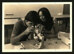 Elbert Covell College Students Using a Microscope by Elbert Covell College