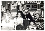 Dewey Chambers with children in costumes by University of the Pacific