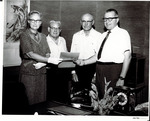 Mr. and Mrs. Walter Raymond Donation of 3500 acres: Mrs. Raymond, [Jess A. Rudkin], Walter Raymond, President Robert E. Burns by Miller Photography