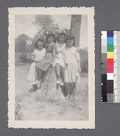 Groups of women #14 [seated on, or leaning on stump]: Kazue Koro (Second from the left)